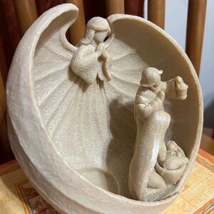 Christmas Nativity Scene Candle Holder featuring the Holy Family.